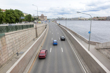 road with cars in St. Petersburg along the Neva river, Arsenal embankment in St. Petersburg