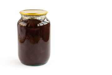 Homemade strawberry jam in glass jar isolated on white background.