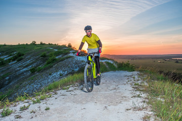 Cyclist Riding the Bike on the Beautiful Mountain Trail. 