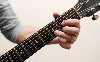 Selective focus,Guitarist,The musicians are catching the guitar chords is D chord on white...