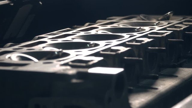 close up refocusing shot of disassembled car's engine with valves. 4k shot