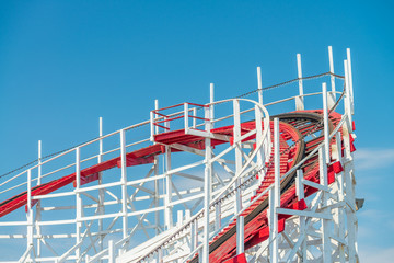 Rollercoaster against blue sky