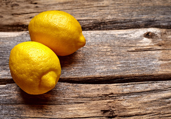 lemons on wooden background