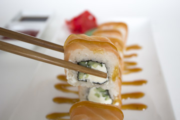 sushi rolls with sticks seafood