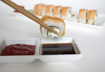 sushi rolls with sticks seafood