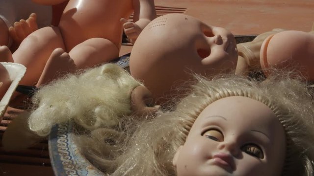 Horrible heads and other parts of dolls bodies