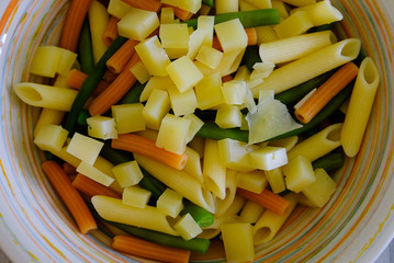 A colorful dish of italian pasta and cheese