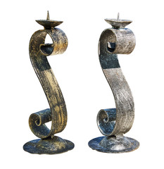 Handmade candlesticks made of metal. Isolated on a white background