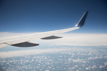 Fototapeta na wymiar Airplane Wing in the Sky