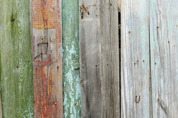 Old rustic fence of color boards