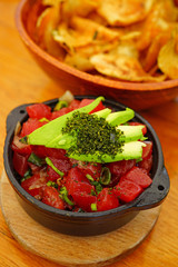 Eating a bowl of Hawaiian ahi tuna poke with avocado