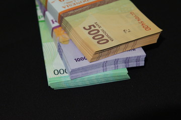 Festive Religion Allowance for Indonesian worker called "THR" is paid with Indonesian banknote Rupiah as legal currency