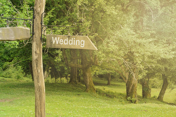 A wooden sign with the inscription 
