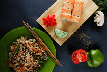 sushi rolls noodles and vegetables