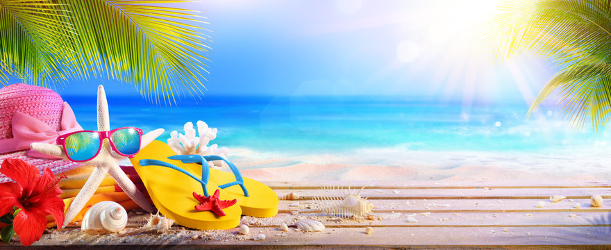 Vacation Concept - Beach Accessories On Table In Tropical Seascape
