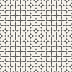Abstract seamless pattern of сrosses with rounded corners and dots.