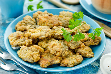 Crispy deep fried chicken livers coated with egg and bread crumbs