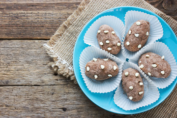 Potato cake - funny cakes from biscuit with butter cream in sweet cocoa powder like a real potatoes