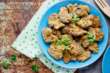 Crispy deep fried chicken livers coated with egg and bread crumbs