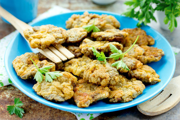 Crispy deep fried chicken livers coated with egg and bread crumbs