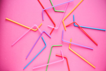 Drinking straws on pink