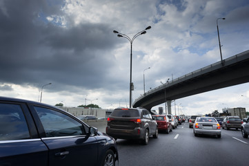 The car runs at high speed on the road. dark sky.