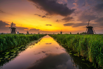 Sunset above old dutch windmills in Kinderdijk, Netherlands