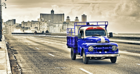 view of a old classic truck in the malecon of havana