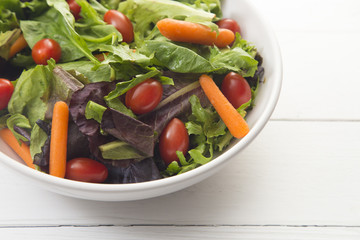 Bowl of Healthy Salad with Carrots and Tomatoes