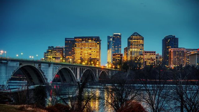 View on Key bridge and Rosslyn skyscrapers at dusk: timelapse of dat to night transition, Washington DC, USA