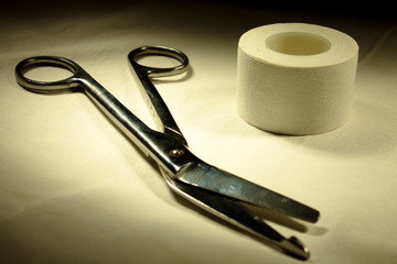 medical scissors and a band-aid