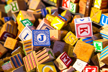 Pile of colorful children’s alphabet wooden block toys
