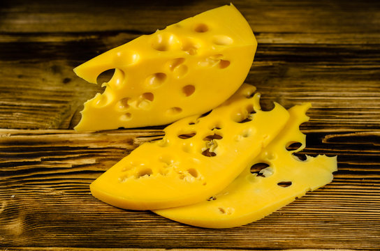 Sliced cheese on wooden table