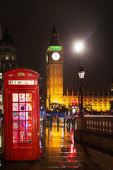 Fototapeta na wymiar Popular tourist Big Ben and Houses of Parlament with red phone b