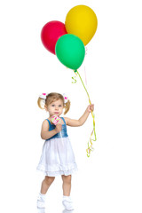 Fototapeta na wymiar Little girl is playing with a balloon
