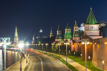 Towers of Moscow Kremlin along Kremlevskaya embankment at night, Russia