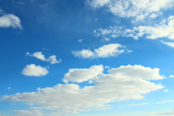 Beautiful natural blue sky and white fluffy clouds. Background. Landscape.