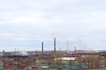 Industrial enterprise in the center of the city. Environmental pollution. Emission of toxic waste...