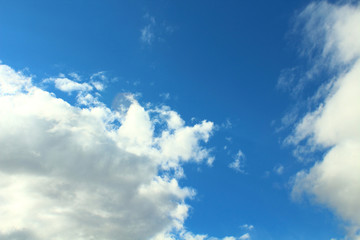 Naklejka na ściany i meble Beautiful blue sky and fluffy white gray clouds. Background. Landscape. Natural appearance.