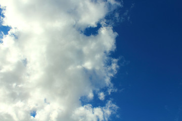 Beautiful natural blue sky and white fluffy clouds. Background. Landscape.