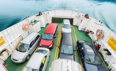 Car ferry in Norway. Autos in line onboard.