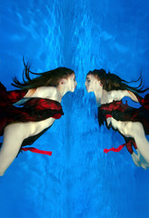 semi-nude young woman looking at her reflection underwater  Far East, Primorye, Primorsky Krai,...
