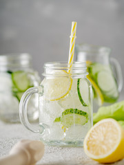 Detox diet. Fresh Summer Drink. Healthy detox fizzy lemonade with lemon and cucumber in mason jar. Healthy food concept