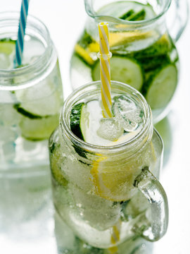 Fresh Summer Drink. Healthy detox fizzy water with lemon and cucumber in mason jar. Healthy food concept.