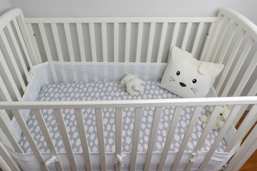 White crib and light gray walls for baby's room