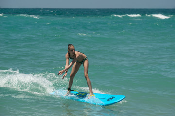 Beautiful young surfer girl