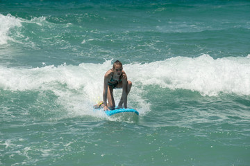 Beautiful young surfer girl