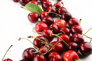 Cherry. Red fresh Cherries in bowl and a bunch of cherries on the table