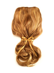 Naklejka premium Auburn hair with curls and a yellow ribbon on a white background