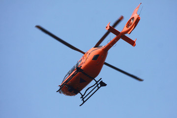 german helicopter in action against blue sky